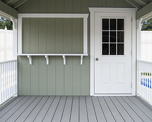 Cape Cod Style Poolside Snack Shed with bar window built by Pine Creek Structures