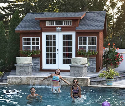 Custom Cape Cod Style Shed By Pool with extra windows, full glass doors, and cape dormer