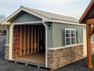 12x20 Peak Garage Meadow Green Vinyl Board and Batten Siding with Cobble Stone on Eave Side